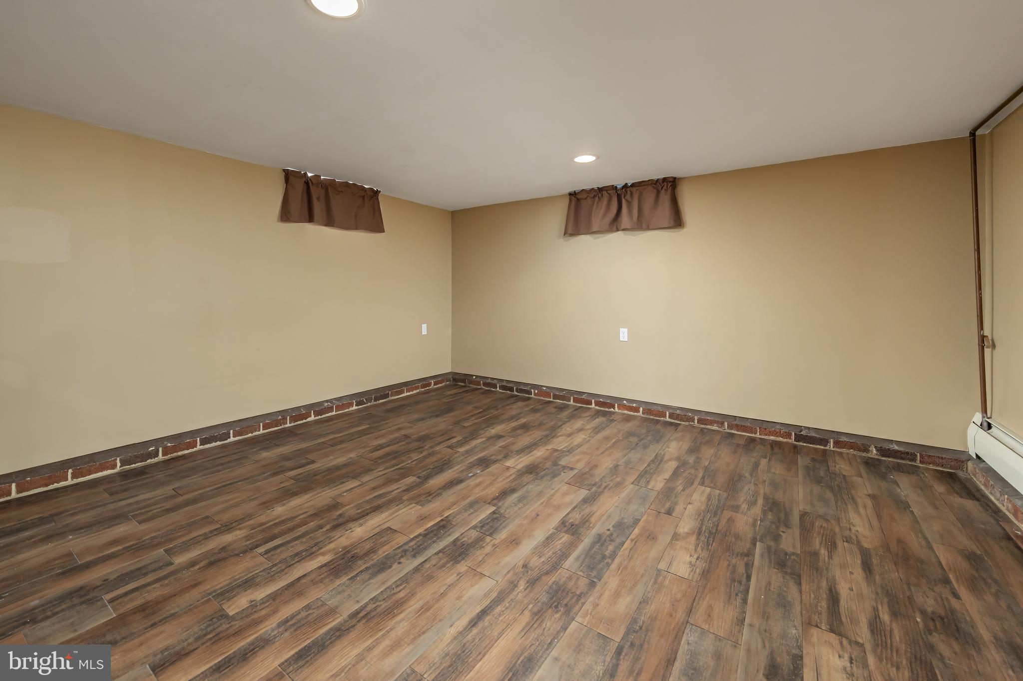 303 Main Street Mantua, NJ 08051 - Photo 25 of 50 a view of an empty room with wooden floor and a window