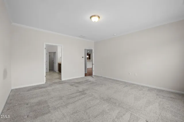 an empty room with windows and yard