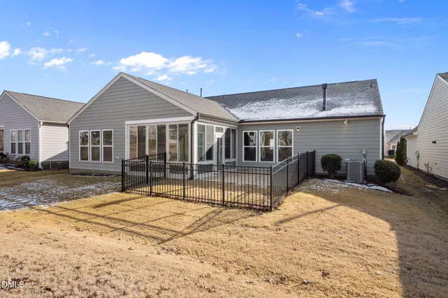 a view of a house with backyard and porch