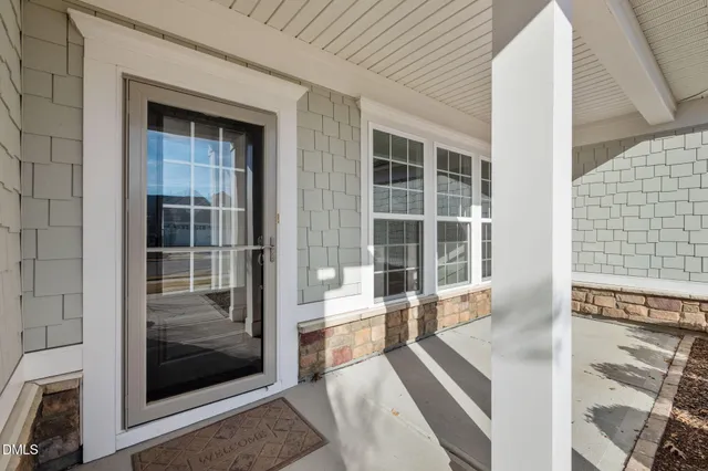 a view of a house with a yard and plants
