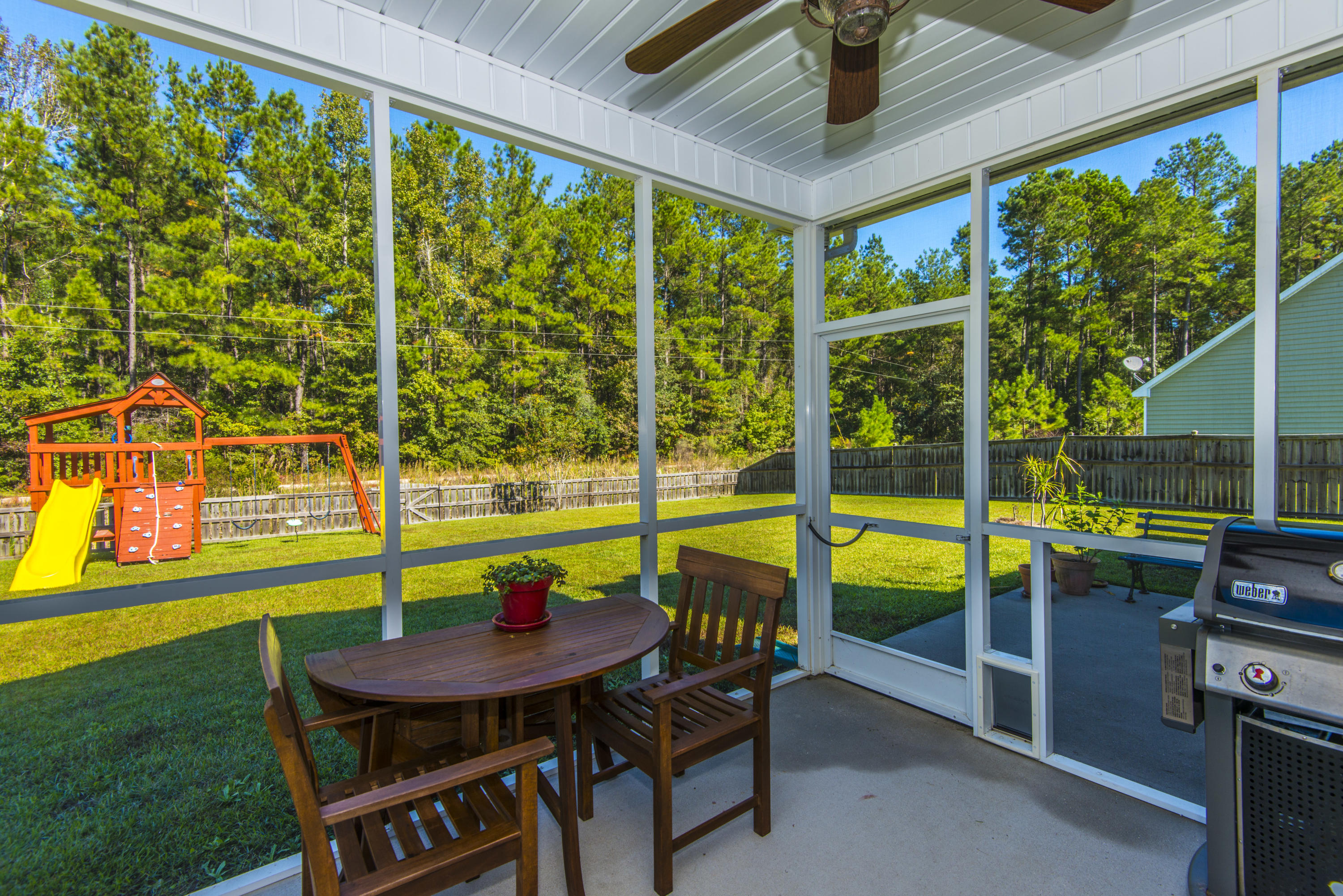3043 Gulfstream Lane Ridgeville, SC 29472 - Photo 38 of 45 Screened Porch off the Kitchen