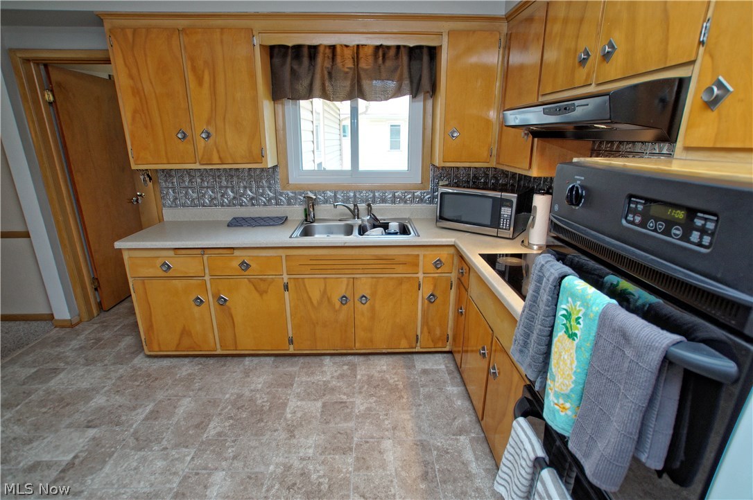 8601 Royal Ridge Drive Parma, OH 44129 - Photo 12 of 33 Stainless steel sink overlooks the back yard.