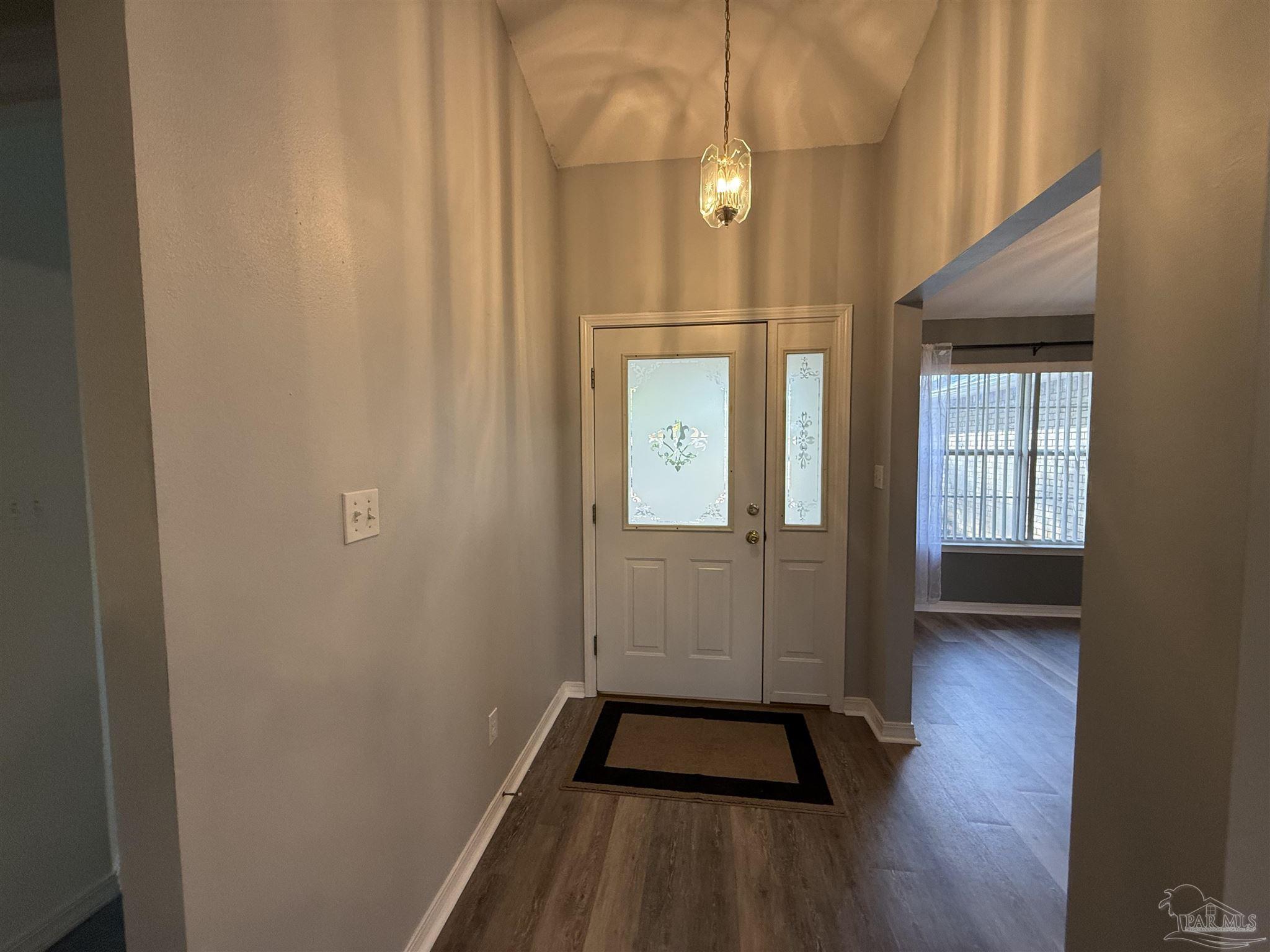 5700 Charmonte Way Milton, FL 32583 - Photo 13 of 29 a view of outdoor space and wooden floor