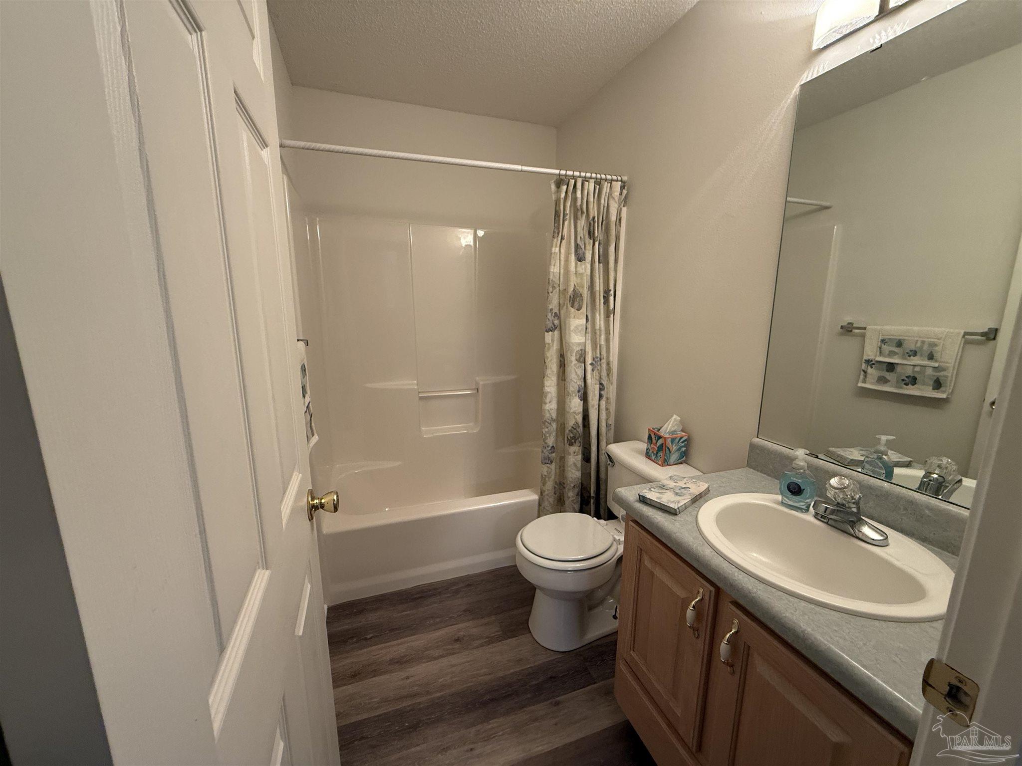 5700 Charmonte Way Milton, FL 32583 - Photo 20 of 29 a bathroom with a sink toilet and shower
