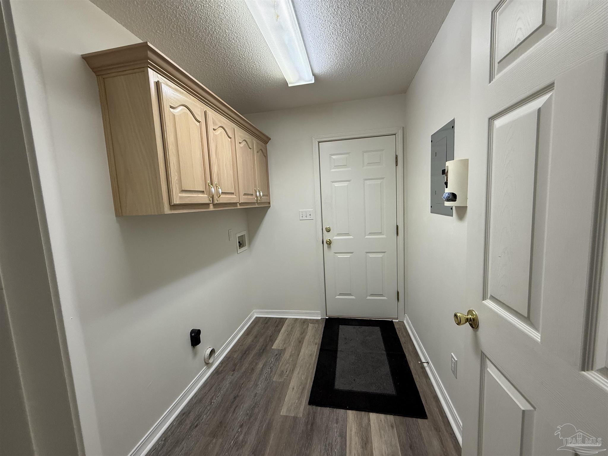 5700 Charmonte Way Milton, FL 32583 - Photo 8 of 29 a view of a room with wooden floor and staircase