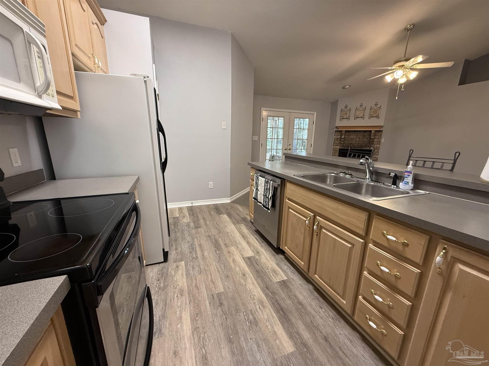 5700 Charmonte Way Milton, FL 32583 - Photo 9 of 29 a spacious bathroom with a granite countertop sink a mirror and a toilet
