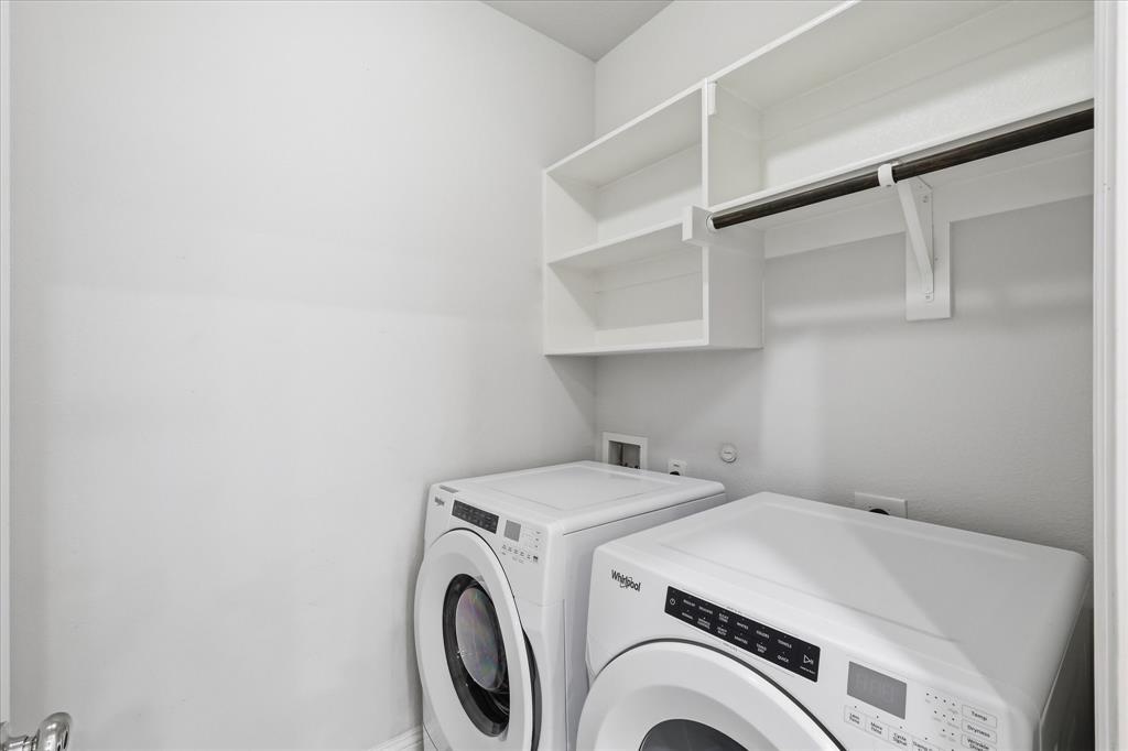 519 Sequoia Street Allen, TX 75002 - Photo 27 of 38 Laundry area featuring bright white walls and a built-in shelving unit with a hanging rod