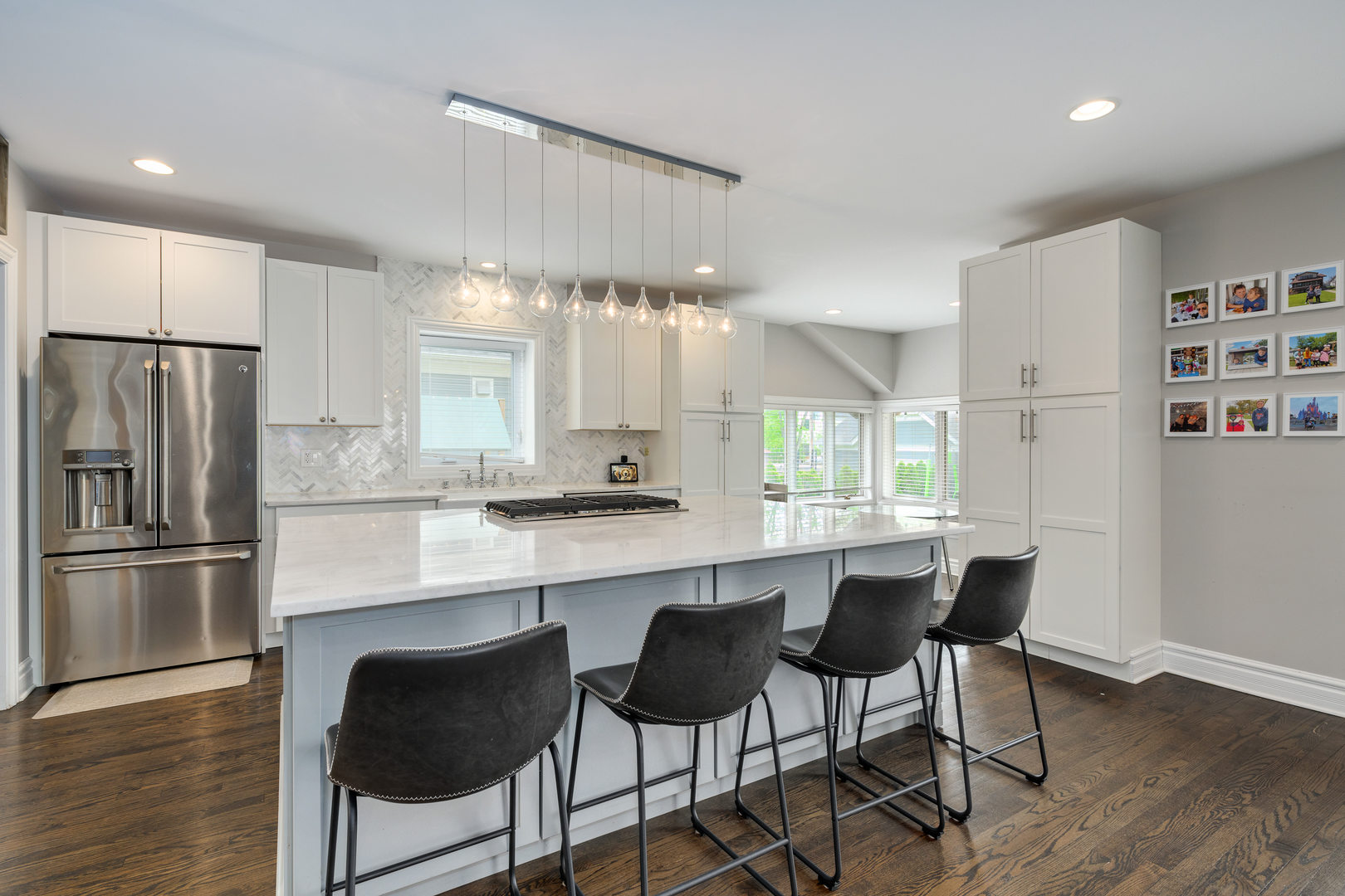 620 South Prospect Avenue Park Ridge, IL 60068 - Photo 12 of 39 a kitchen with stainless steel appliances a dining table chairs refrigerator and sink