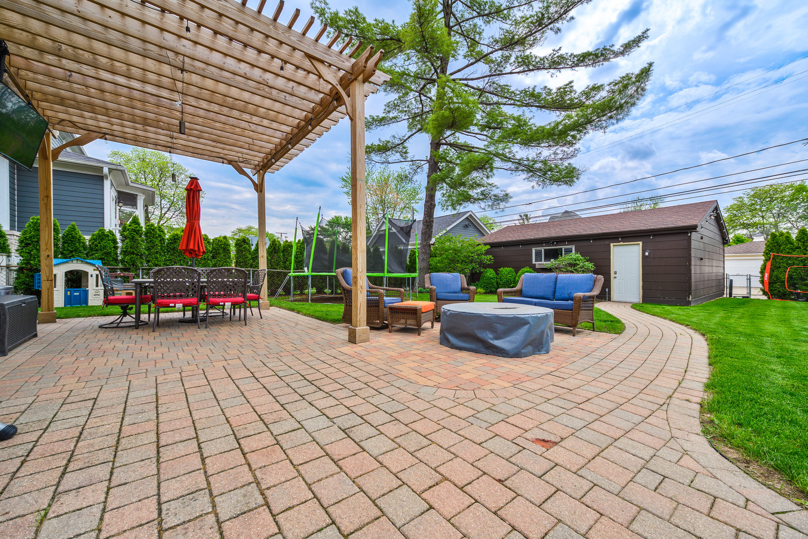 620 South Prospect Avenue Park Ridge, IL 60068 - Photo 36 of 39 a view of a patio with table and chairs potted plants and a large tree