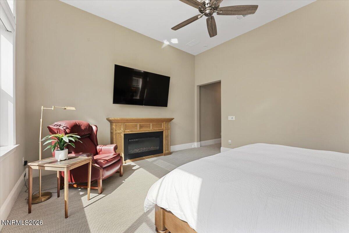 722 West Pleasant Oak Trail Reno, NV 89511 - Photo 22 of 98 a bedroom with a bed and a fireplace