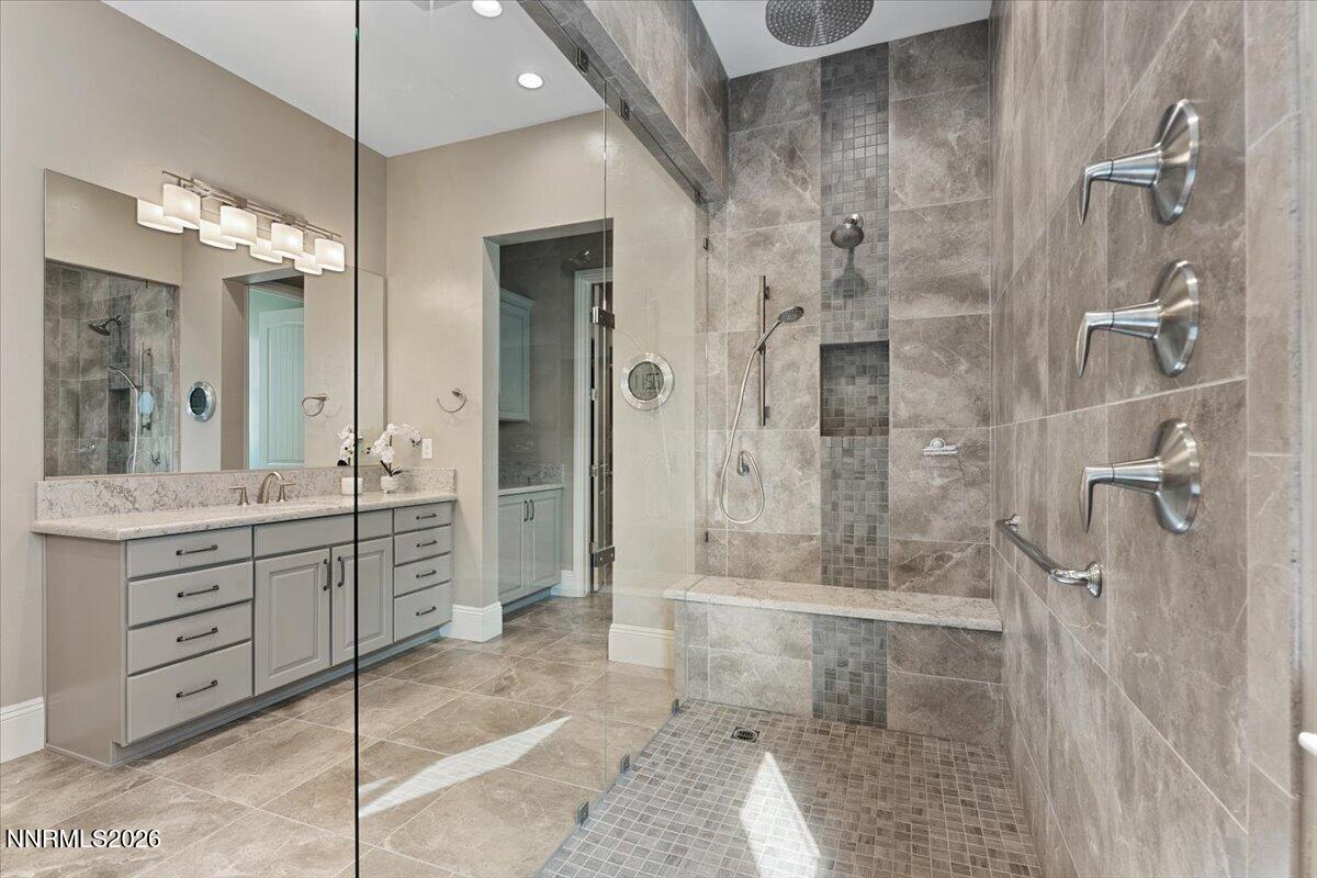 722 West Pleasant Oak Trail Reno, NV 89511 - Photo 24 of 98 a bathroom with a granite countertop sink a mirror and a shower