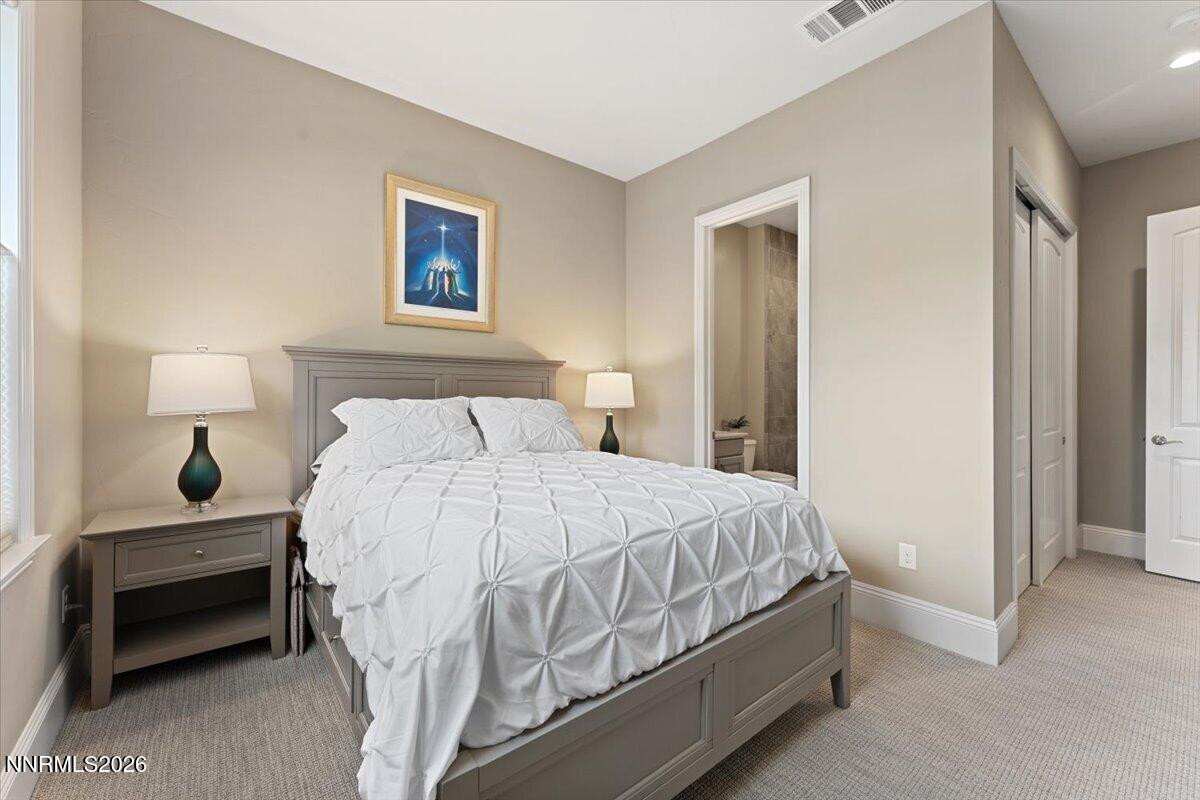 722 West Pleasant Oak Trail Reno, NV 89511 - Photo 28 of 98 a bedroom with a bed and a lamp