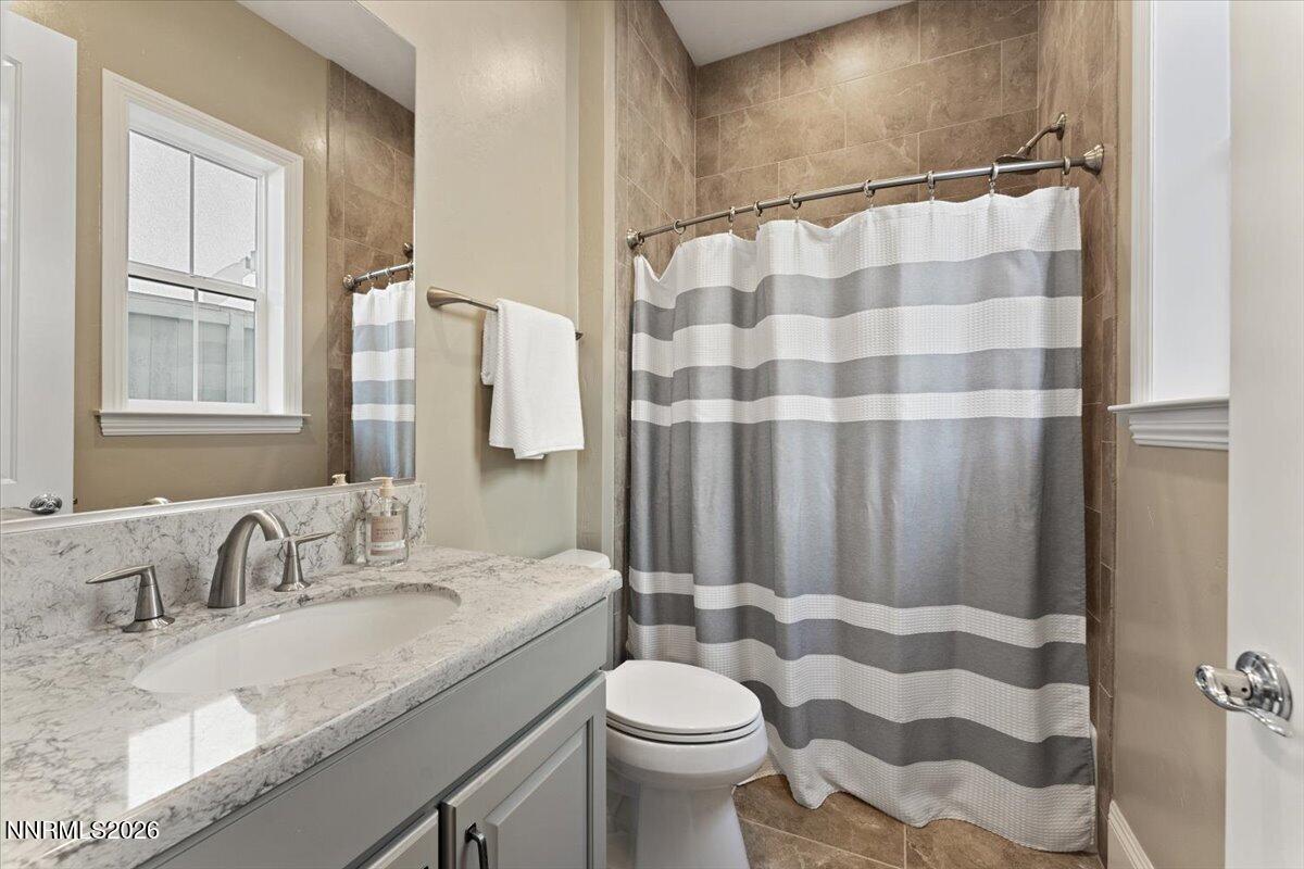 722 West Pleasant Oak Trail Reno, NV 89511 - Photo 32 of 98 a bathroom with a granite countertop sink toilet and shower