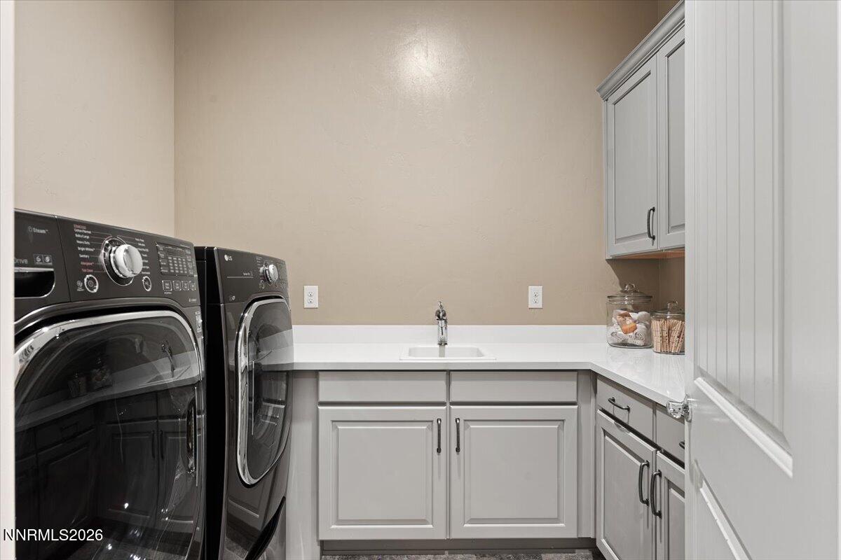 722 West Pleasant Oak Trail Reno, NV 89511 - Photo 34 of 98 a utility room with stainless steel appliances granite countertop a sink and cabinets