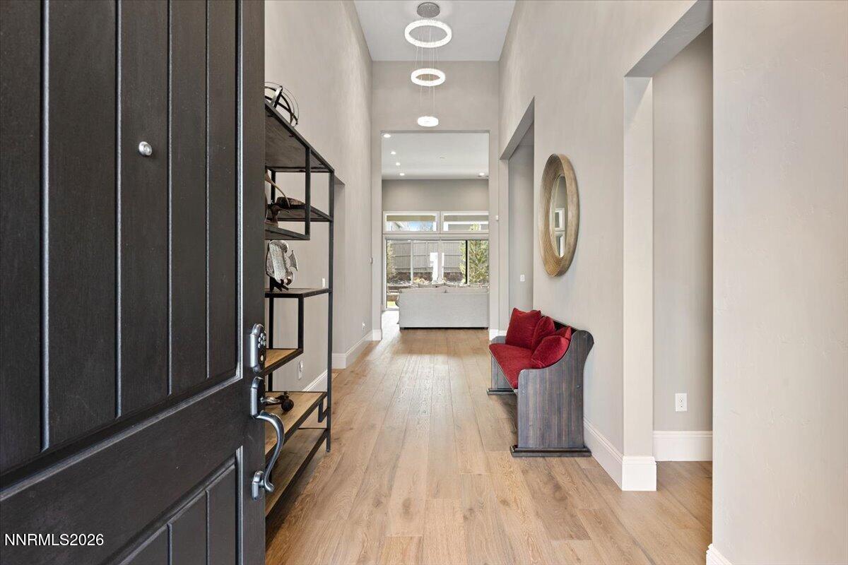 722 West Pleasant Oak Trail Reno, NV 89511 - Photo 4 of 98 a very nice looking room with wooden floor and a bathroom