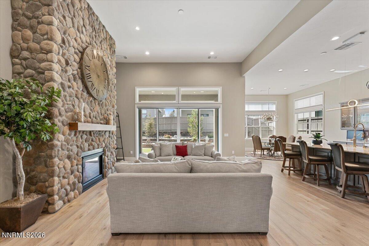 722 West Pleasant Oak Trail Reno, NV 89511 - Photo 6 of 98 a living room with fireplace furniture and a large window