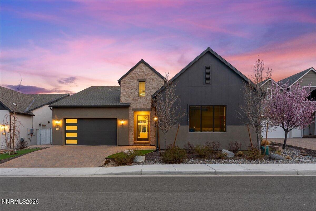 722 West Pleasant Oak Trail Reno, NV 89511 - Photo 65 of 98 a front view of a house with a yard and garage