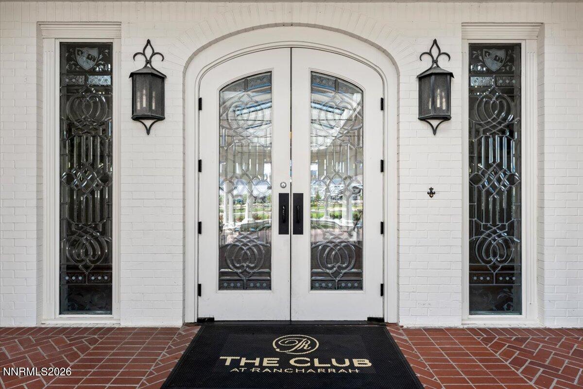 722 West Pleasant Oak Trail Reno, NV 89511 - Photo 85 of 98 a view of a hallway with wooden floor and a potted plant