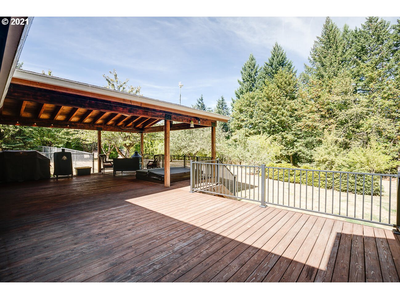 22255 Southeast Ridgeview Drive Damascus, OR 97089 - Photo 16 of 32 a view of a patio with wooden floor