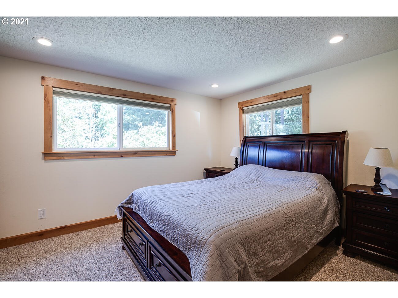 22255 Southeast Ridgeview Drive Damascus, OR 97089 - Photo 17 of 32 a bedroom with a bed and a dresser