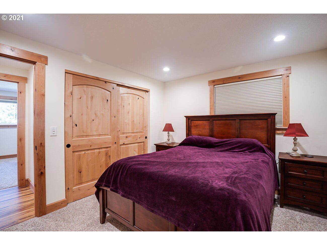 22255 Southeast Ridgeview Drive Damascus, OR 97089 - Photo 20 of 32 a bedroom with a bed and wooden floor