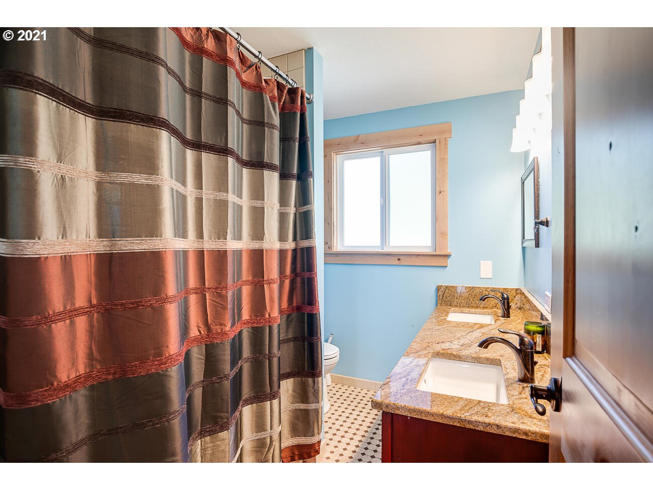 22255 Southeast Ridgeview Drive Damascus, OR 97089 - Photo 21 of 32 a bathroom with a sink and mirror