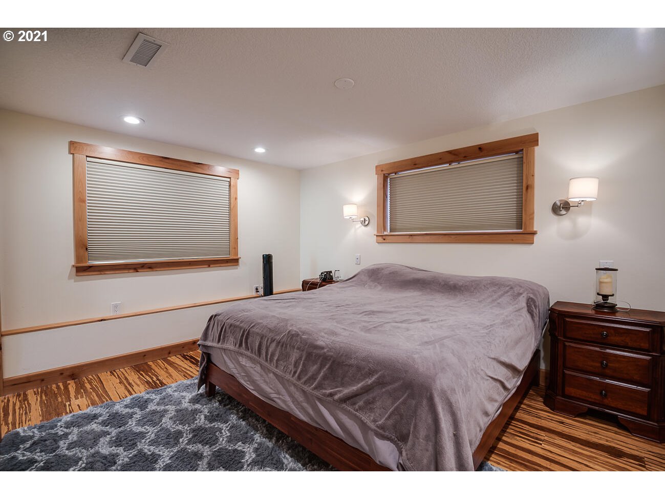 22255 Southeast Ridgeview Drive Damascus, OR 97089 - Photo 25 of 32 a bedroom with a bed and a painting on the wall