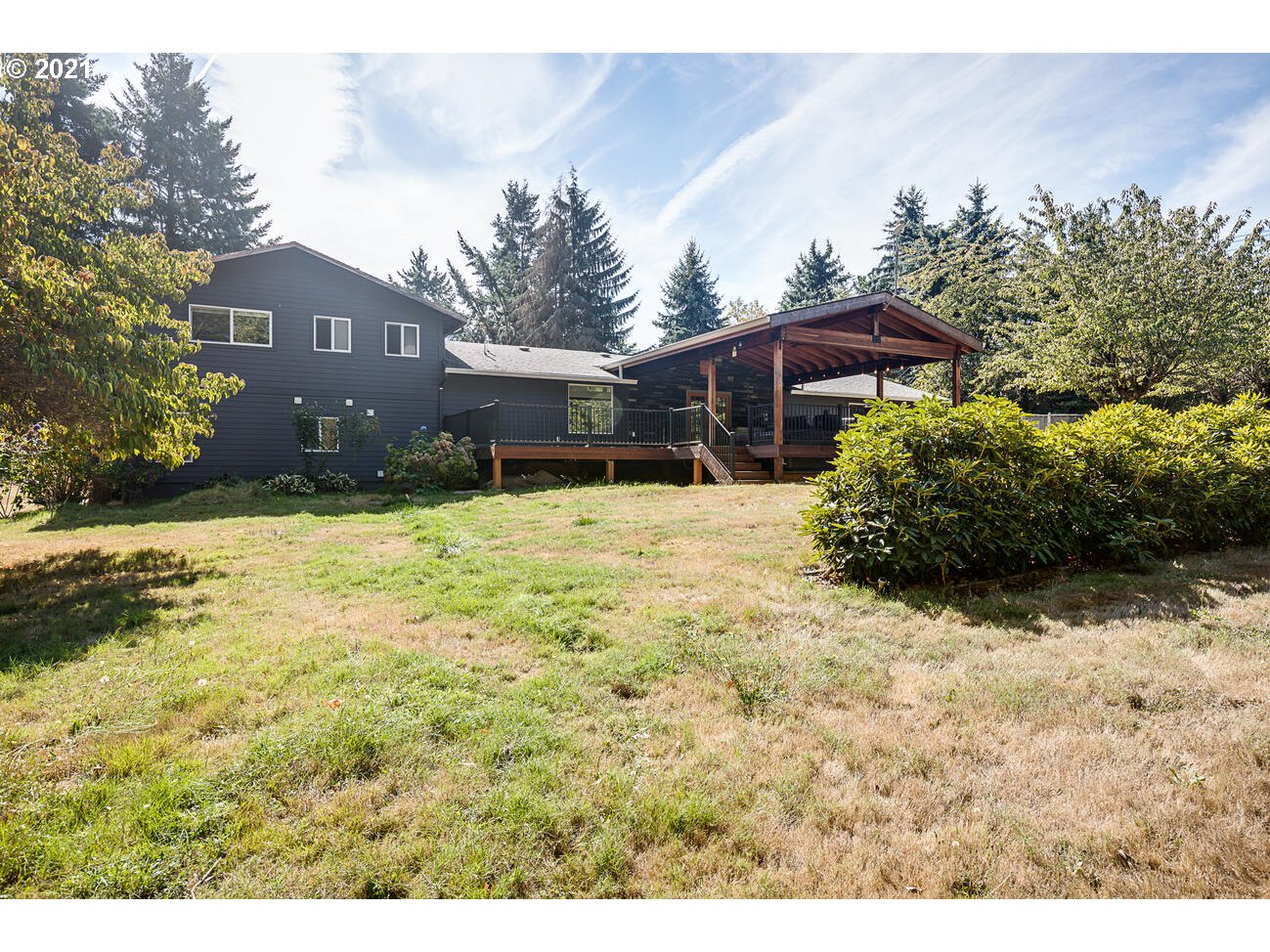 22255 Southeast Ridgeview Drive Damascus, OR 97089 - Photo 30 of 32 a front view of a house with a yard