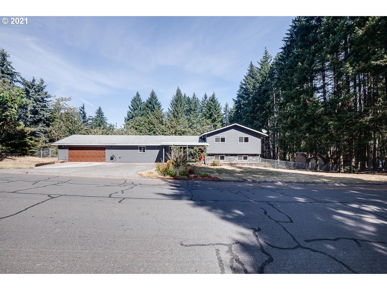 22255 Southeast Ridgeview Drive Damascus, OR 97089 - Photo 32 of 32 a view of house with outdoor space and sitting area
