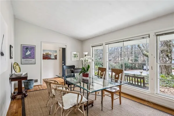 a view of a livingroom with furniture and a window