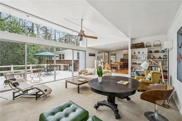 a view of a livingroom with furniture and a window