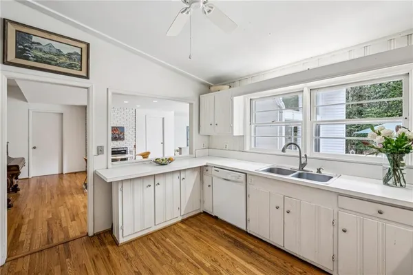 a spacious bathroom with a double vanity sink and a mirror