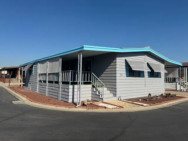 a view of a house with a street