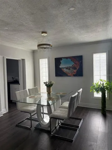a view of a livingroom with furniture and a window