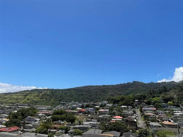 a view of a city with mountains in the background