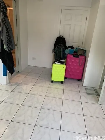 a bathroom with a granite countertop sink a toilet a mirror and vanity