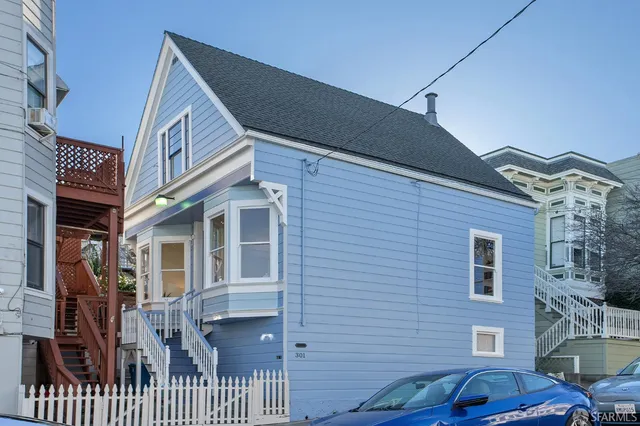 a view of a brick house with many windows