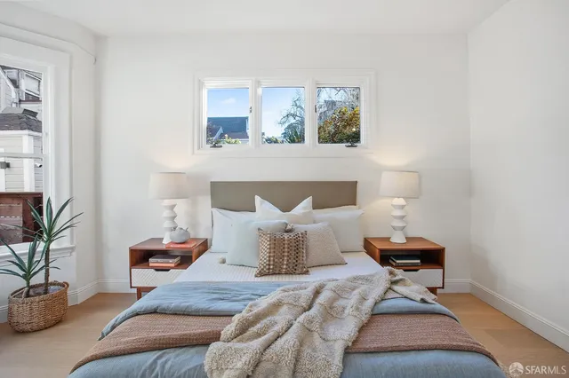 a bedroom with a bed and window
