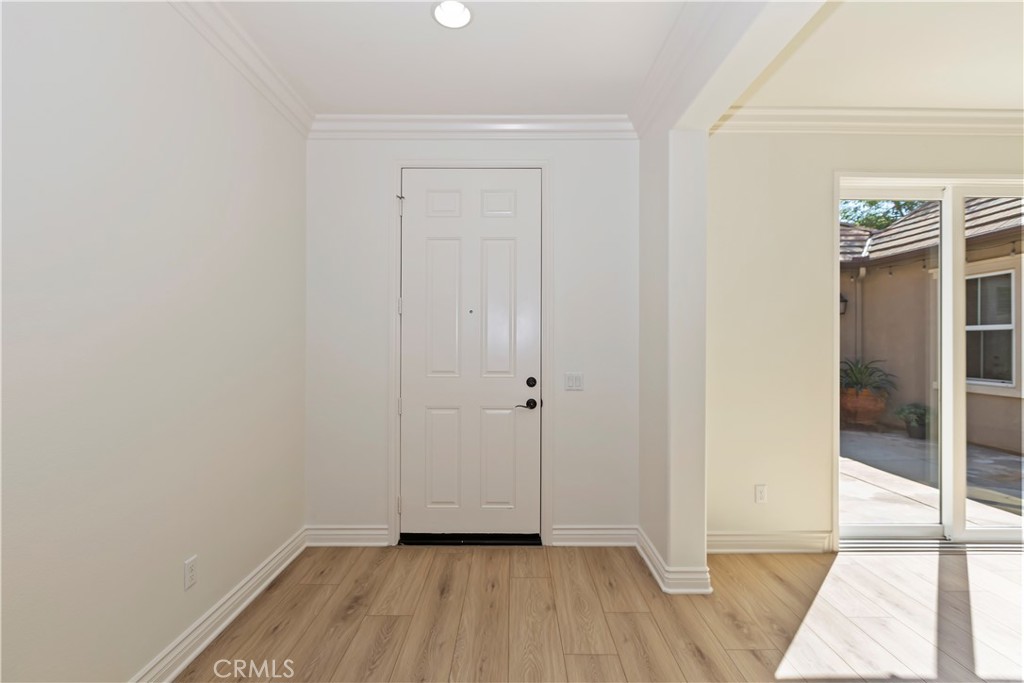 6336 Sloane Court Rancho Cucamonga, CA 91739 - Photo 12 of 69 a view of an empty room with wooden floor