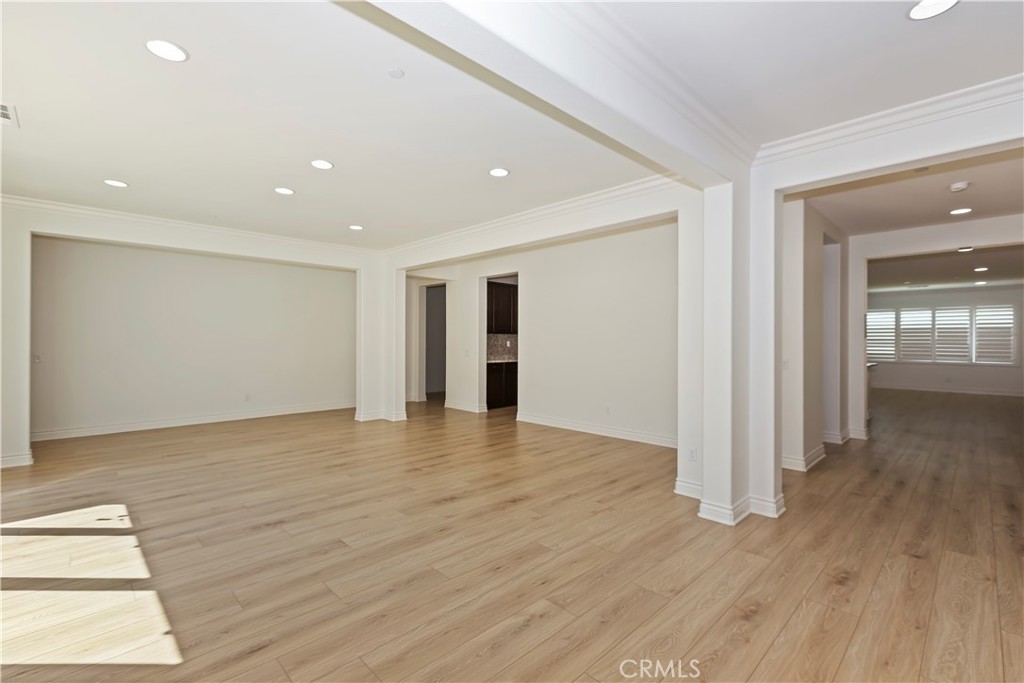 6336 Sloane Court Rancho Cucamonga, CA 91739 - Photo 15 of 69 a view of an empty room with wooden floor and a window