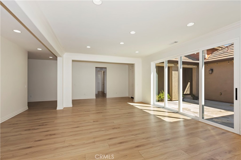 6336 Sloane Court Rancho Cucamonga, CA 91739 - Photo 16 of 69 a view of an empty room with wooden floor and a window