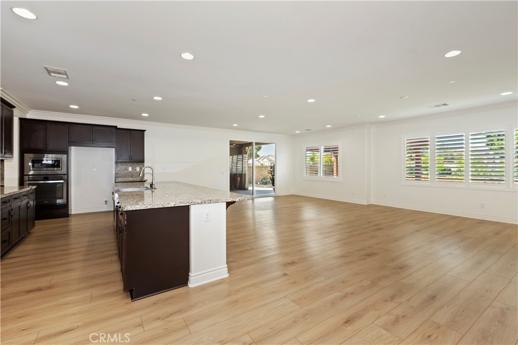 6336 Sloane Court Rancho Cucamonga, CA 91739 - Photo 20 of 69 a view of kitchen with cabinets and wooden floor