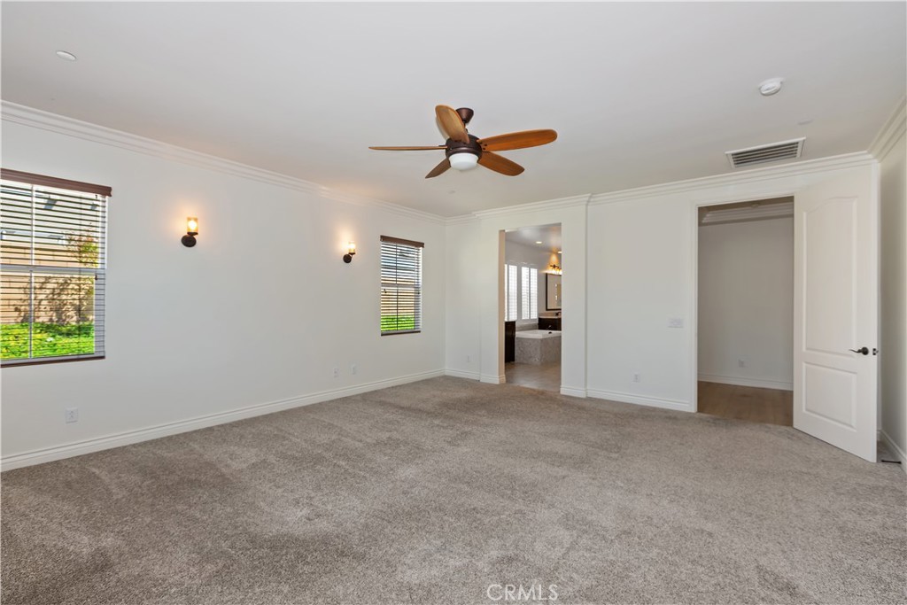 6336 Sloane Court Rancho Cucamonga, CA 91739 - Photo 27 of 69 an empty room with windows and fan