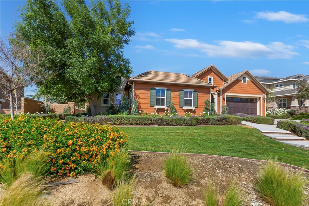 6336 Sloane Court Rancho Cucamonga, CA 91739 - Photo 3 of 69 a front view of a house with a garden