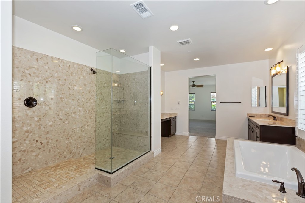 6336 Sloane Court Rancho Cucamonga, CA 91739 - Photo 31 of 69 a bathroom with a glass shower door