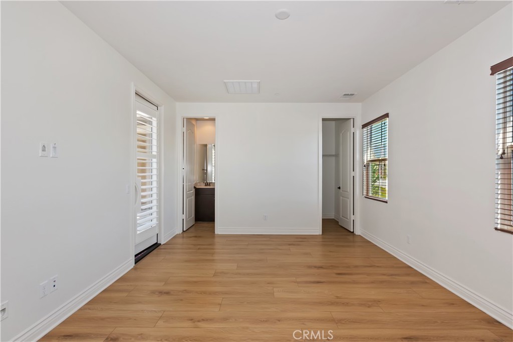 6336 Sloane Court Rancho Cucamonga, CA 91739 - Photo 40 of 69 a view of an empty room with wooden floor