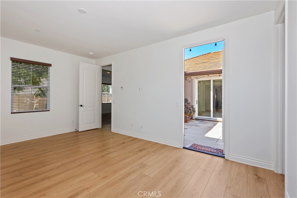 6336 Sloane Court Rancho Cucamonga, CA 91739 - Photo 45 of 69 a view of an empty room with wooden floor and a window
