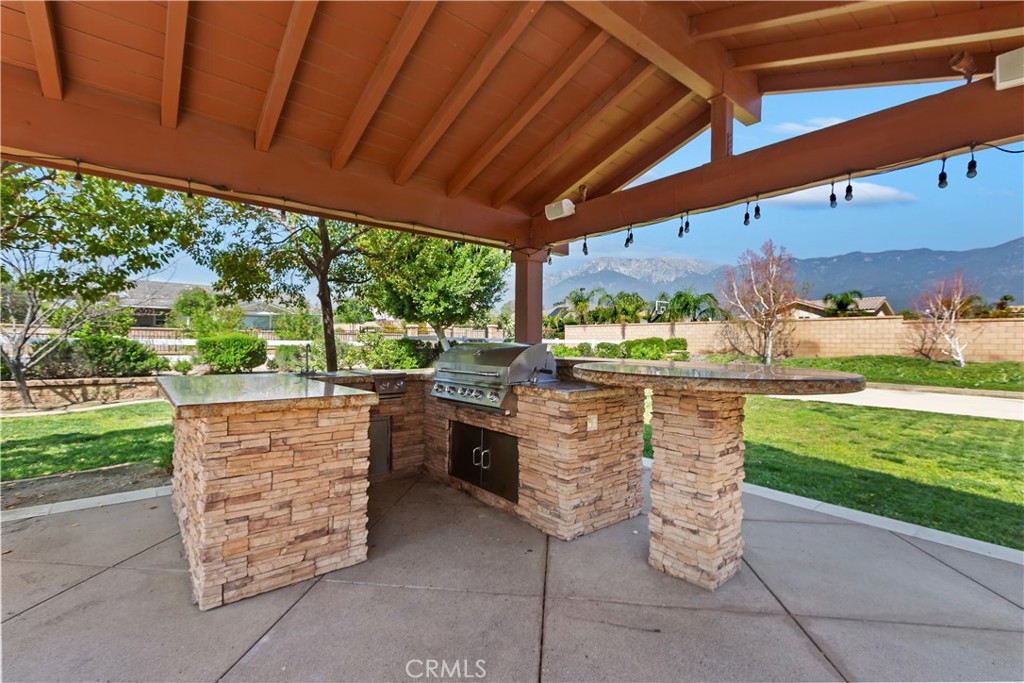 6336 Sloane Court Rancho Cucamonga, CA 91739 - Photo 51 of 69 a view of an outdoor kitchen and a yard