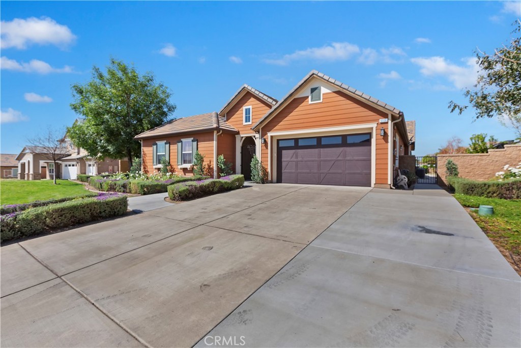 6336 Sloane Court Rancho Cucamonga, CA 91739 - Photo 6 of 69 a front view of a house with a yard and garage
