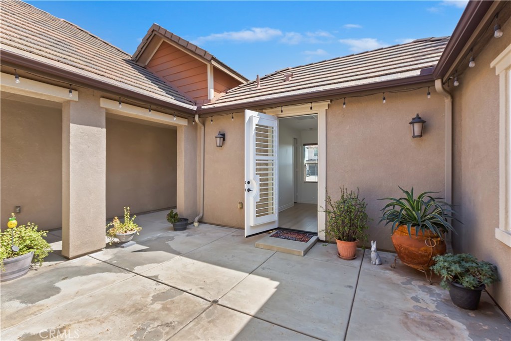 6336 Sloane Court Rancho Cucamonga, CA 91739 - Photo 9 of 69 a view of a house with potted plants